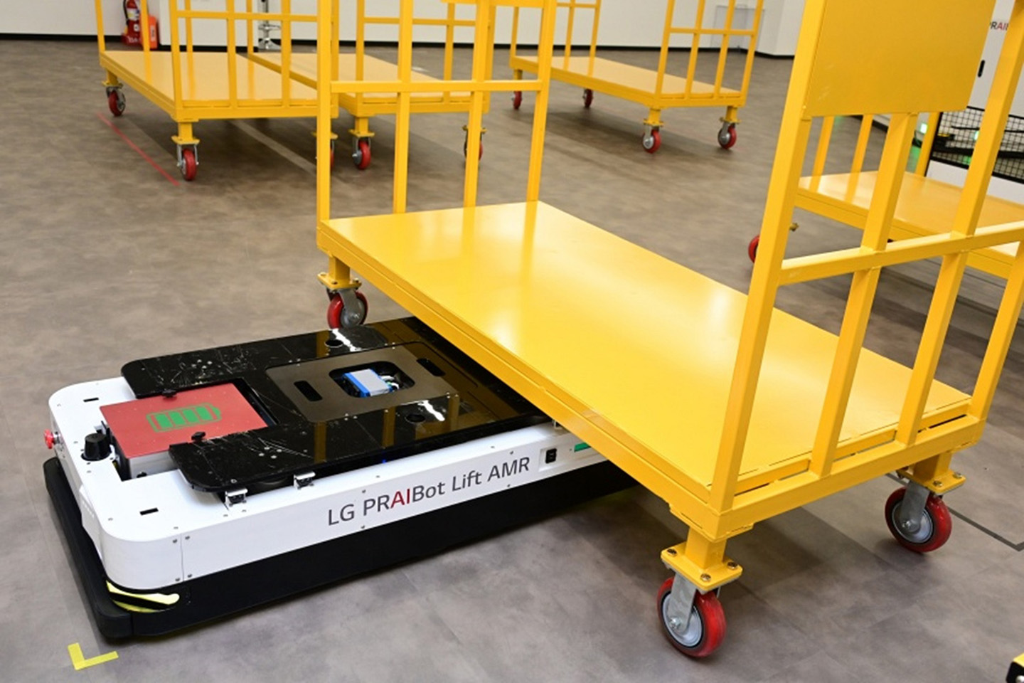 A photo of factory robot lifting