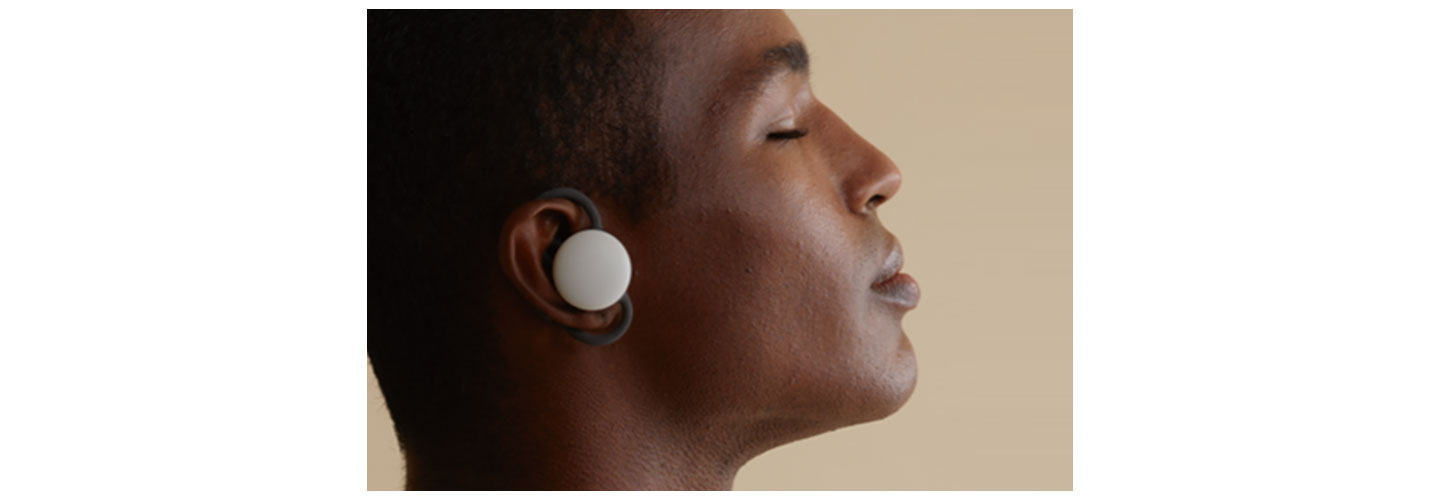 An image of a man using the brid.zzz wireless earbuds with his eyes closed