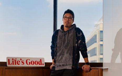 A photo of Choi Joong-ho, professional at LG's Brand Strategy Team, standing next to a table