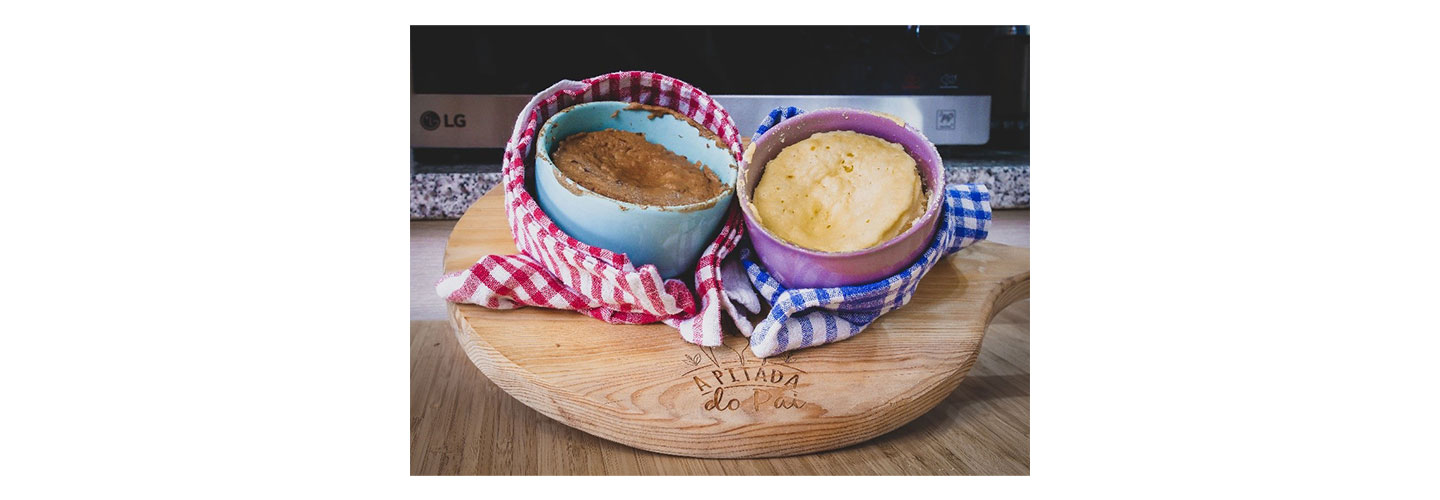 Two recently prepared souffles placed on a pizza board in front of the LG NeoChef microwave oven