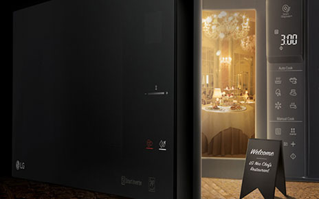 A creative image of the LG NeoChef microwave oven with its door opening to reveal a fancy restaurant inside 