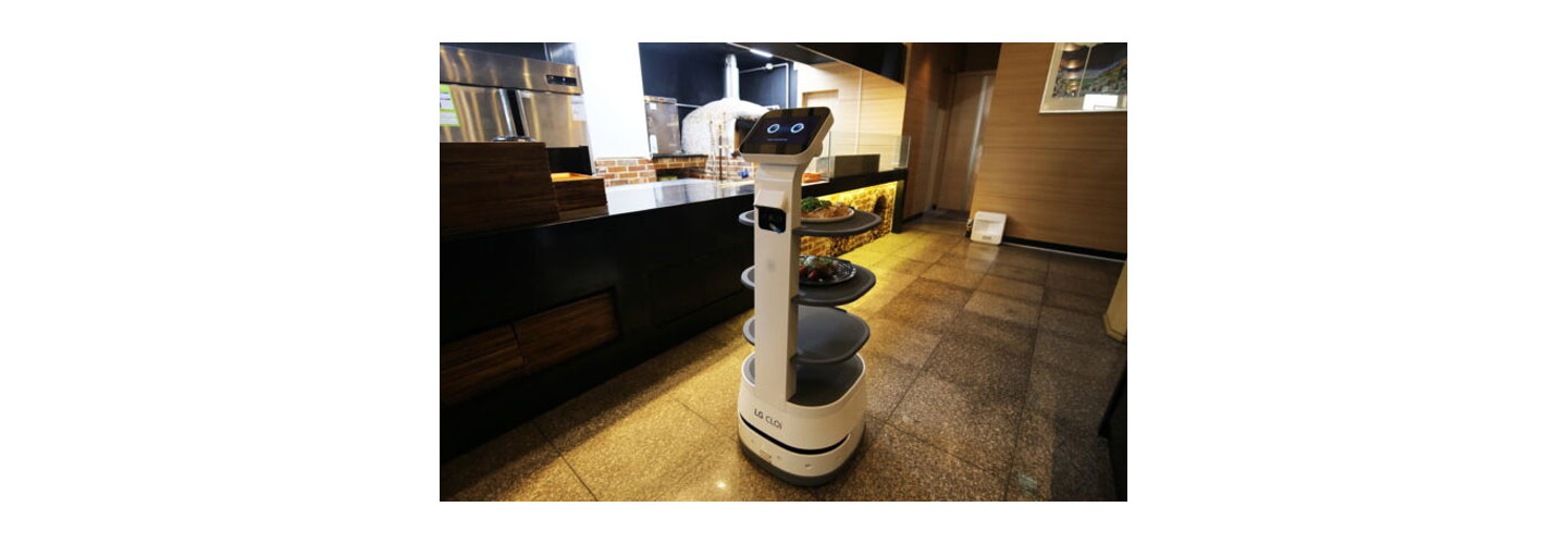 LG CLOi ServeBot being prepared to deliver meals to guests by the restaurant’s kitchen