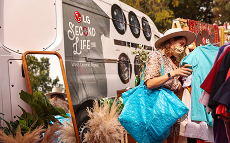A woman looking through the clothes on display at The Second Life Campaign venue which is being hosted by LG Electronics