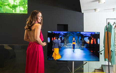 Influencer Eliana Chrysikopoulou pictured with LG G1 OLED at Koudounaris’s showroom