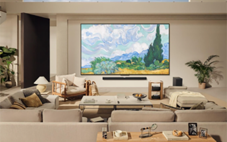 A vivid display of Van Gogh’s “Wheat Field with Cypresses” is displayed on a wall-mounted LG Smart TV through LG Gallery+ in a premium living room.