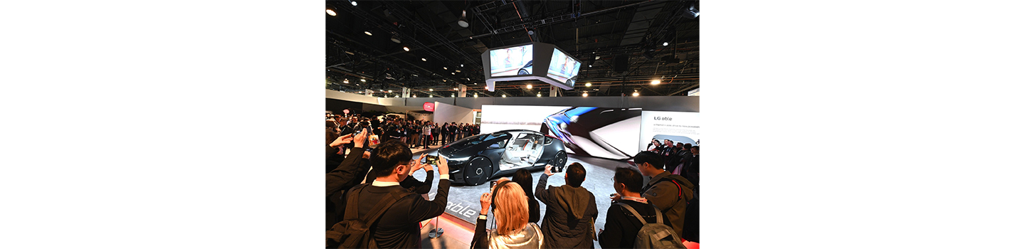 A photo of people admiring the new Alpha-able vehicle