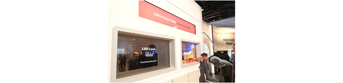 A photo of a person looking at the Life's Good Hotel display demonstration