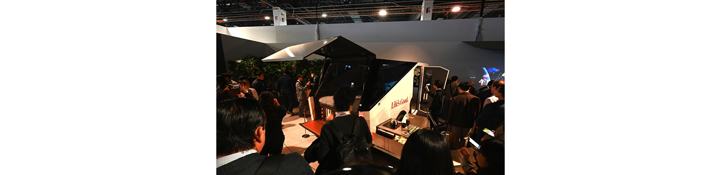 A photo of people taking a look at the new camping trailer Bon Voyage