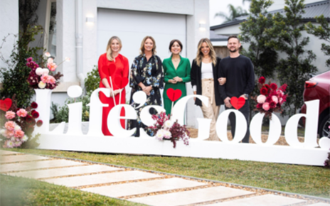 A picture of five people standing behind a Life's Good logo