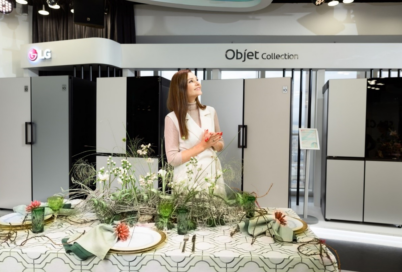 Actress Glafira Tarkhanova posing in front of LG Objet refrigerators at the showcase in Russia. 