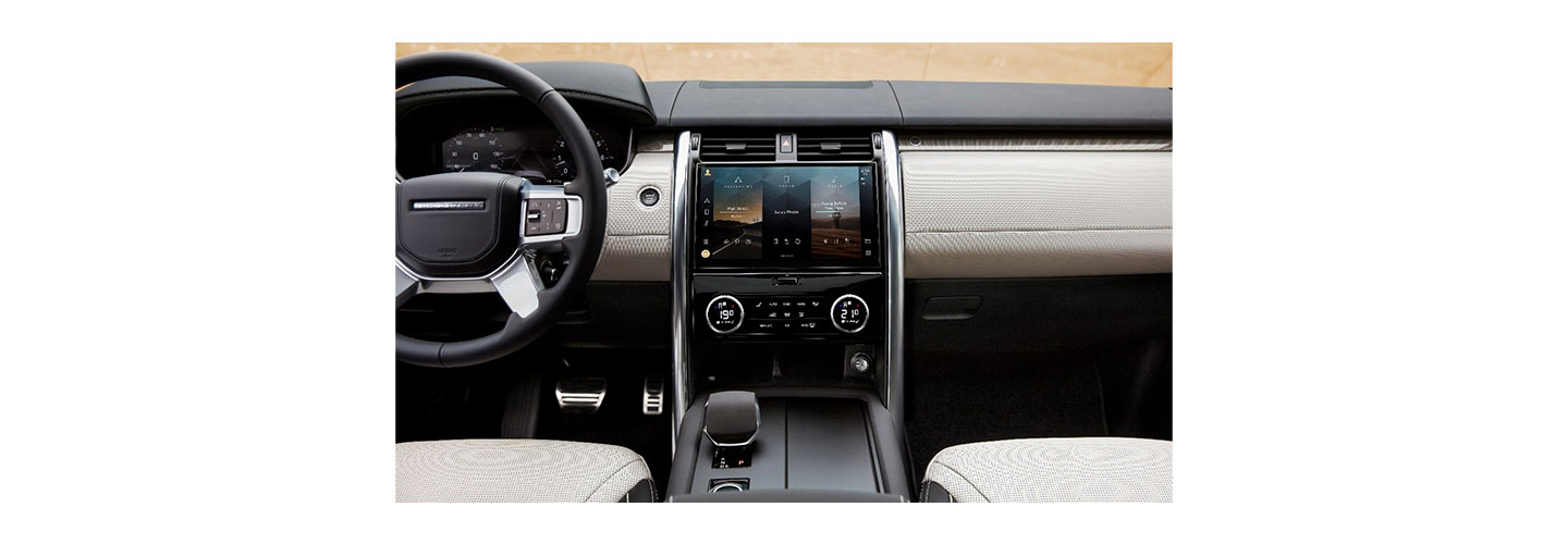 The front interior of the Land Rover Discovery model with the Pivi Pro infotainment system LG helped make