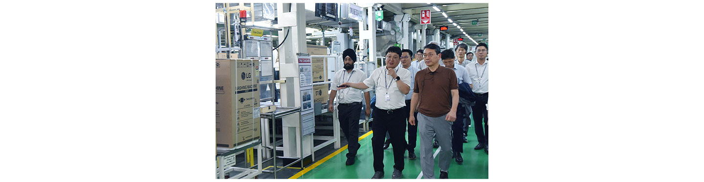 LG CEO taking a tour around LG plant in India