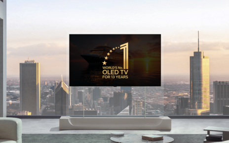An LG OLED TV on a transparent stand against a city skyline displays a graphic of the “World’s No.1 OLED TV for 13 Years.”