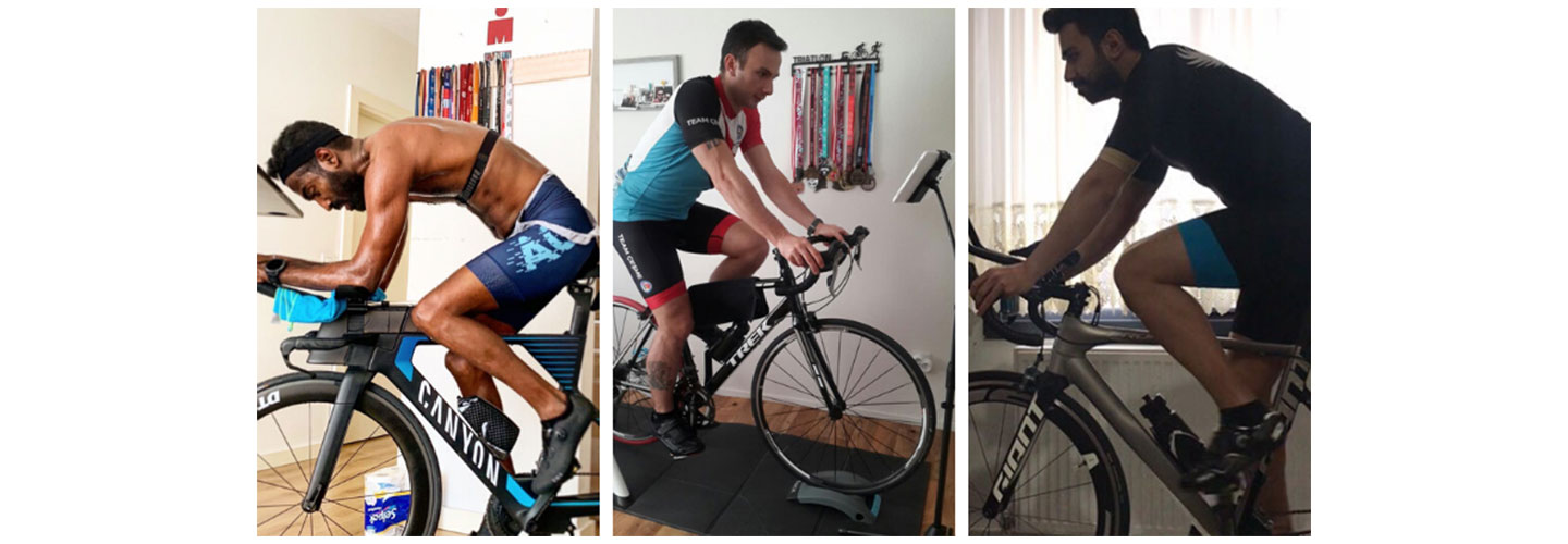Three male participants of the LG Nanocell / SWEATers Indoor Cycle Challenge hold nothing back as they ride for first place at home