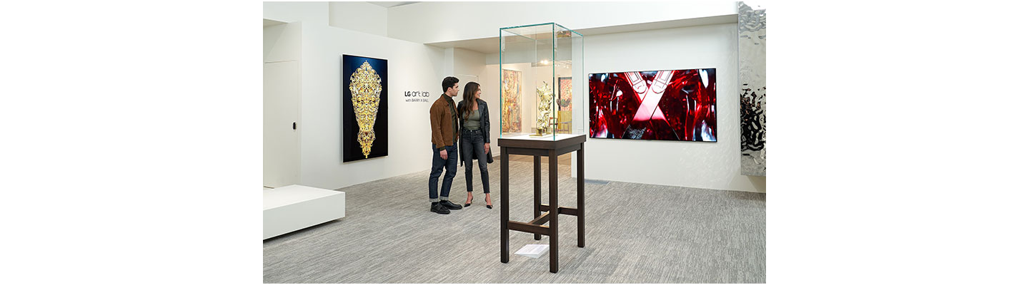 A man and a woman observing the Barry X Ball artwork displayed on an LG OLED TV at the LG OLED Art project exhibition