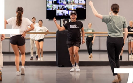 Performers of the Sydney Dance Company practicing in the studio.