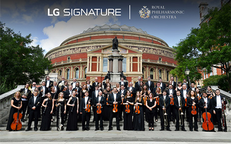  The Royal Philharmonic Orchestra posing outside the Royal Albert Hall with the logos of LG SIGNATURE and the orchestra above