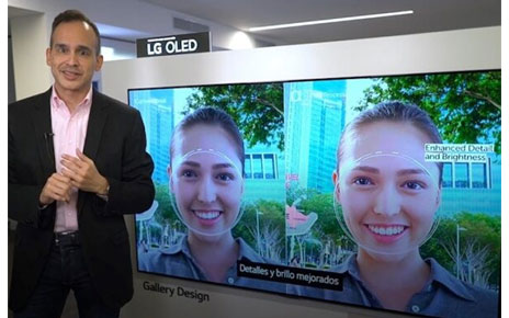  Luis Gálvez of LG stands in front of a newly launched LG OLED TV as he talks about its enhanced detail and brightness