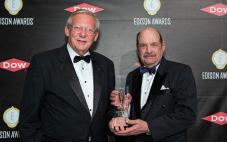 John Taylor, Senior Vice President of Public Affairs for LG USA receives the trophy from the representative of 2019 Gold Edison Award.