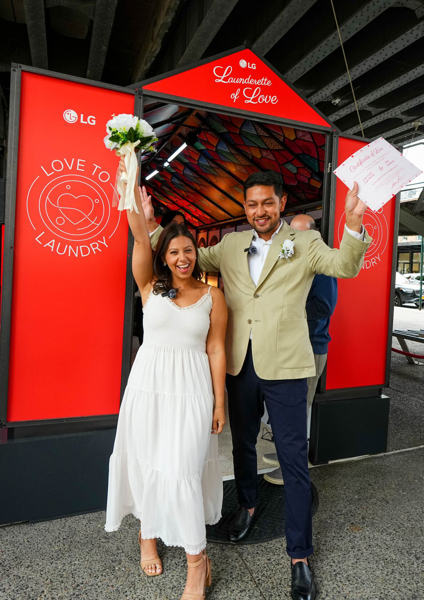 A photo of couple in front of the small build-in wedding venue