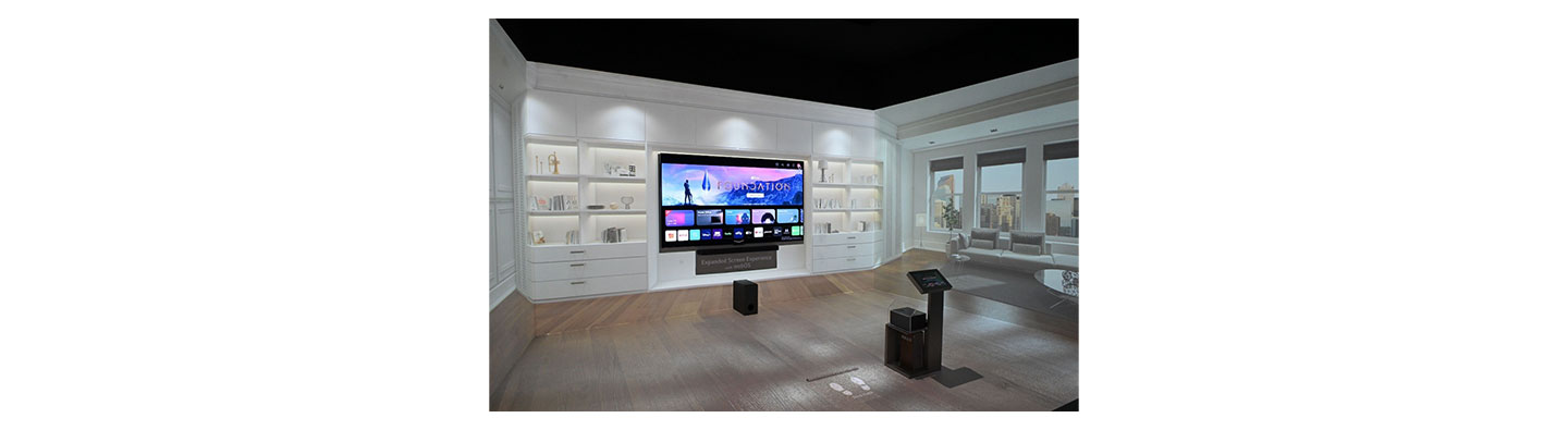 LG OLED TV mounted on the wall of a display room while screening the newly updated webOS UI at CES 2023 to showcase the expanded screen experience with webOS