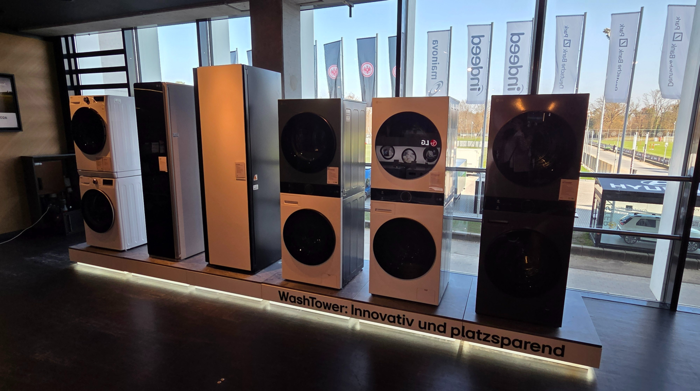 A row of LG WashTowers is on display at the booth.