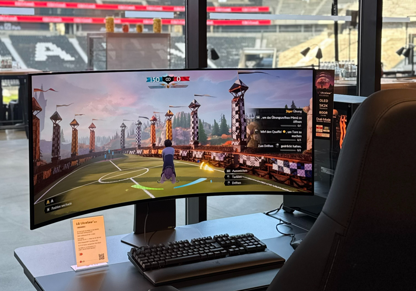 The nearest display in a row of gaming setups features an LG UltraGear evo 52-inch G9 gaming monitor.