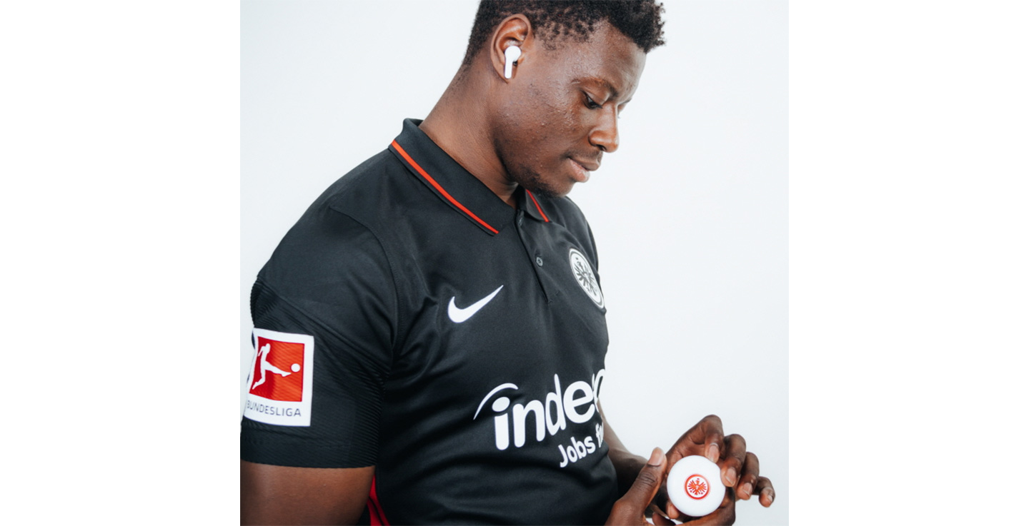 Ragnar Ache, who plays striker for the Bundesliga’s Eintracht Frankfurt football club, posing with the Eintracht Frankfurt TONE Free