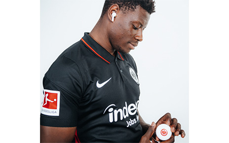Ragnar Ache, who plays striker for the Bundesliga’s Eintracht Frankfurt football club, posing with the Eintracht Frankfurt TONE Free