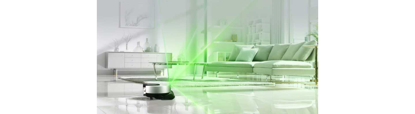 A promotional image of LG CordZeroThinQ beaming green light over the living room as it scans the room.