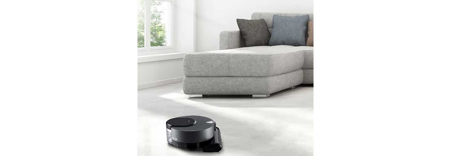 LG CordZeroThinQ vacuuming the living room carpet via the ThinQ™ app.