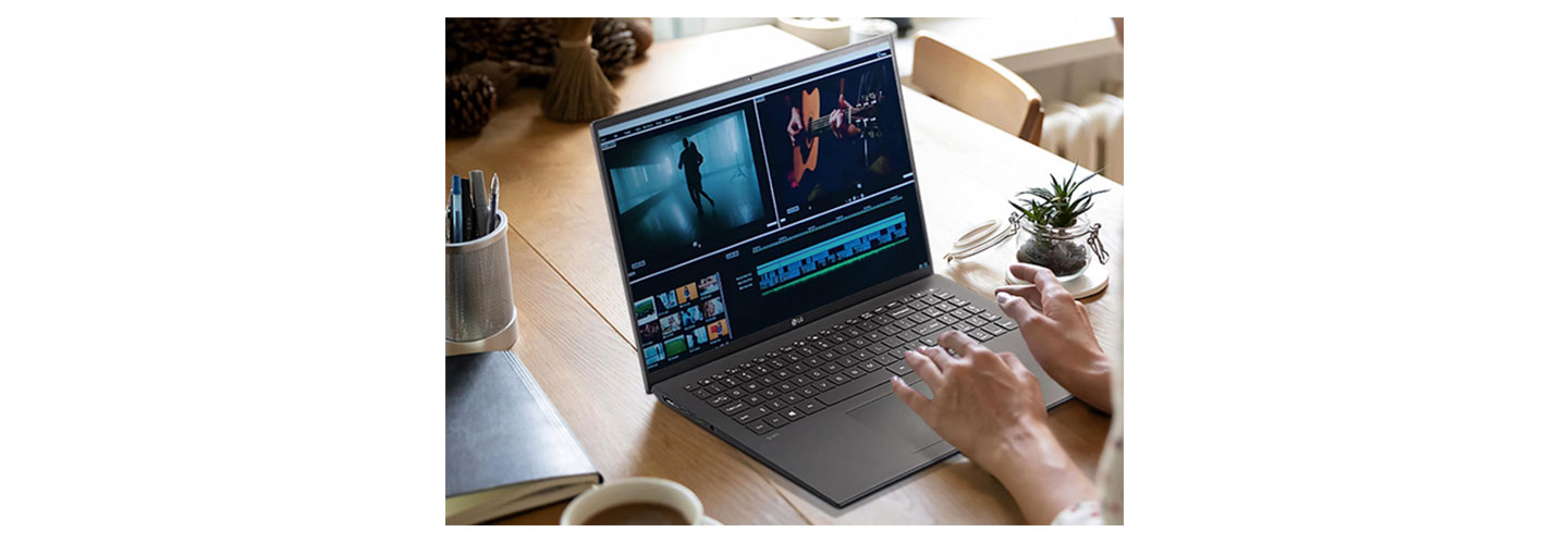 A person editing a video on their LG gram at home.