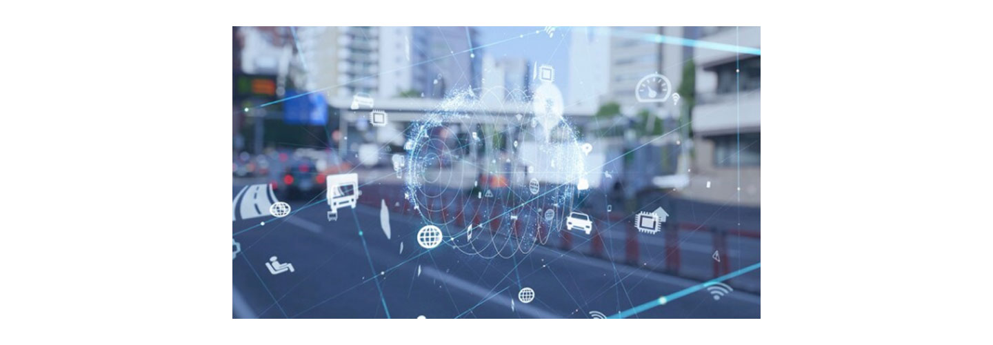 Small icons depicting automobile, chip, wifi and more overlapping a blurred image of a street view