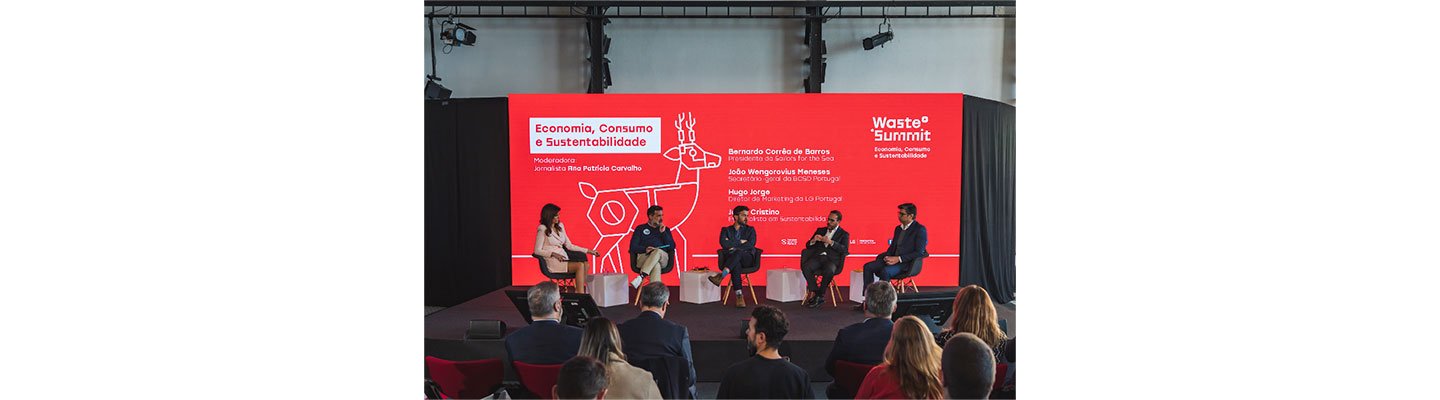 Waste Summit panel members having a discussion on stage at the Waste Summit.