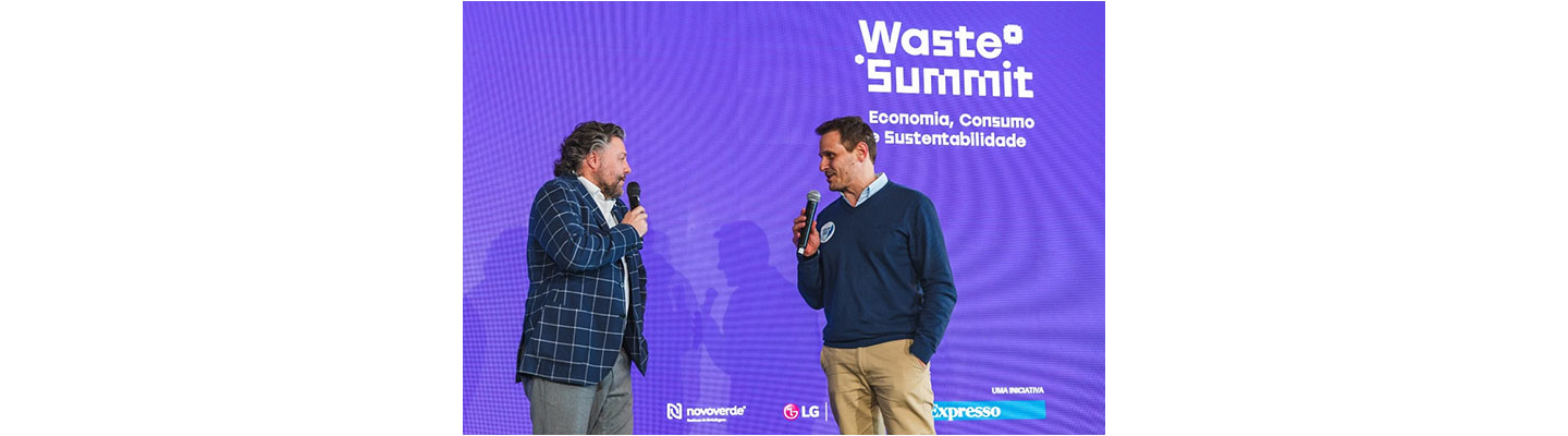 Comedian César Mourão and Isaac Silveira, vice president of Sailors for the Sea, talking on stage at the Waste Summit.