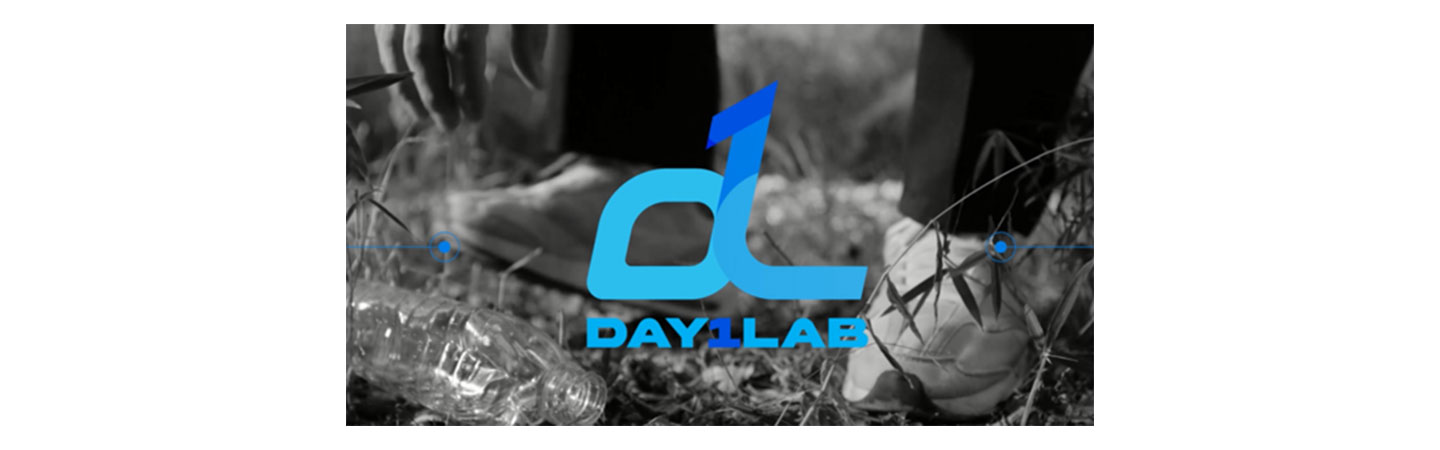 The logo of Day1Lab with someone picking up a plastic bottle in the background.