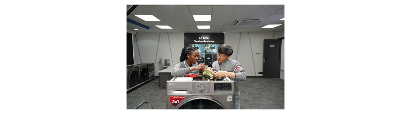 Libanos Tadiyos inspecting a part of LG Washer with her director