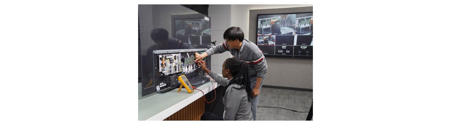 Libanos Tadiyos working with the director to inspect LG TV