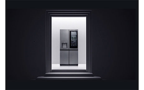View of LG SIGNATURE InstaView Door-in-Door Refrigerator through a door frame.