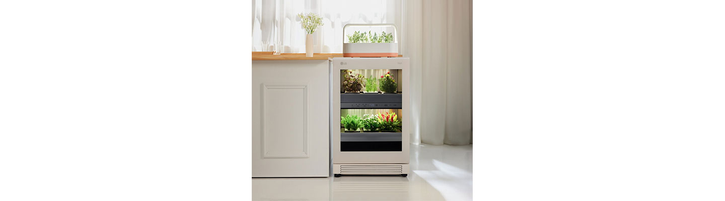 A front view of LG tiiun Nature Beige indoor gardening appliance with tiiun mini on its top