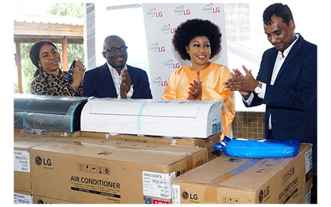 Four people applauding to appreciate LG West Africa's donation of LG DUALCOOL air conditioners