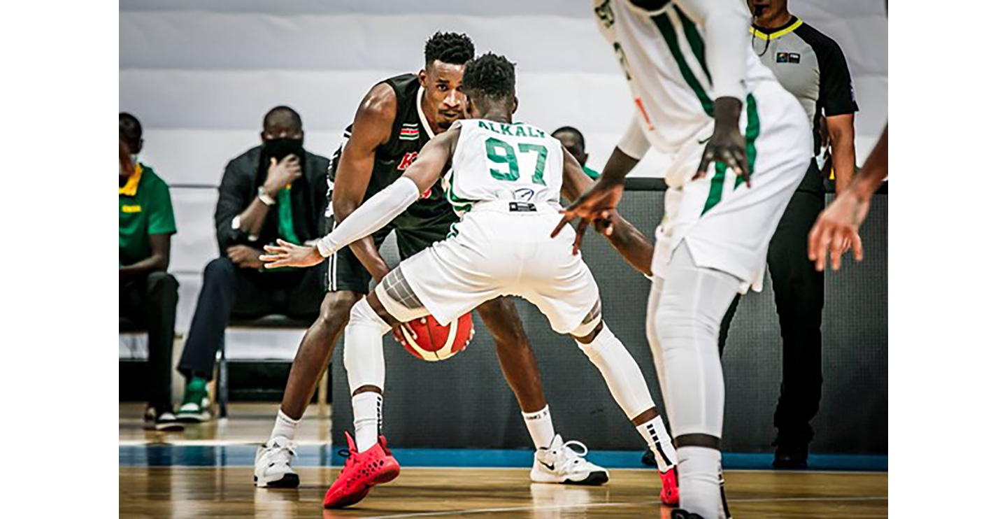 Tylor Okari Ongwae being guarded during a national basketball game