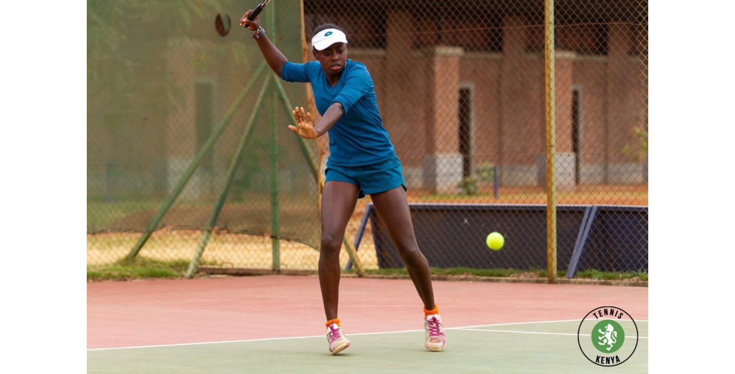 Angela Okutoyi swinging her racket during tennis practice