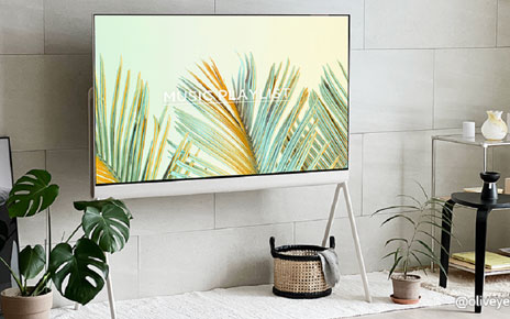 A photo of the LG Objet Collection Pose TV placed next to the living room wall