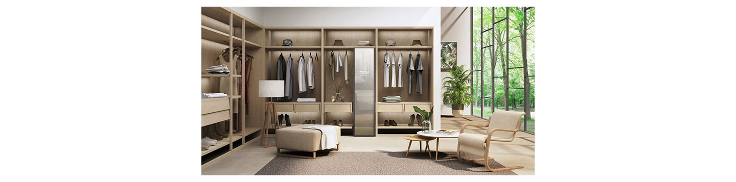 LG Styler effortlessly blending into a modern dressing room with smart clothes hanging up on either side