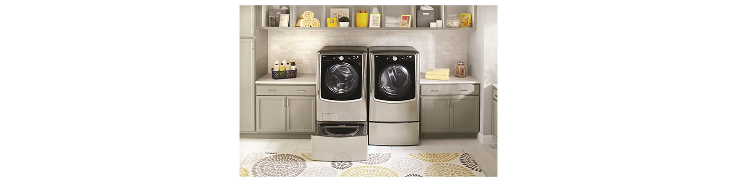 LG TWINWash in a laundry room with its extra drum open.