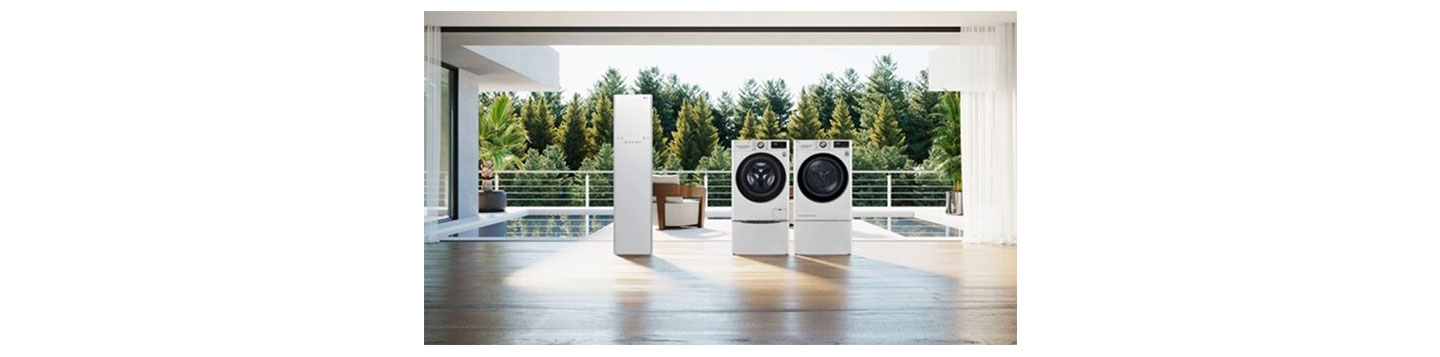 The white LG Styler and LG TWINWash being displayed in a spacious living room that overlooks a pool and a green forest.
