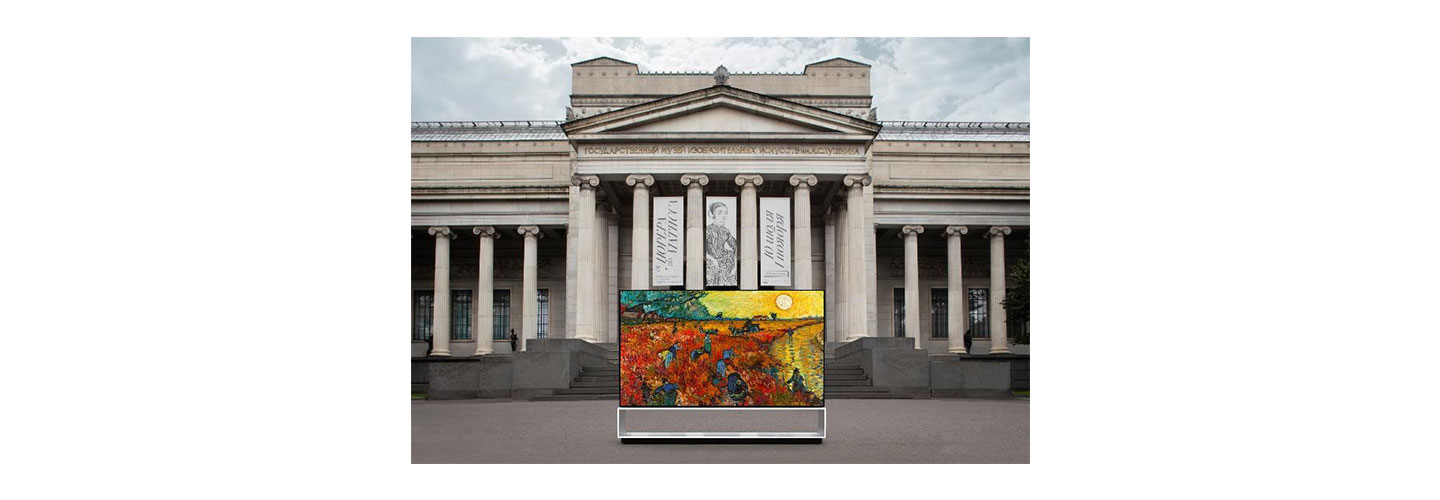 LG SIGNATURE OLED 8K TV displaying a painting in front of the majestic Pushkin Museum building