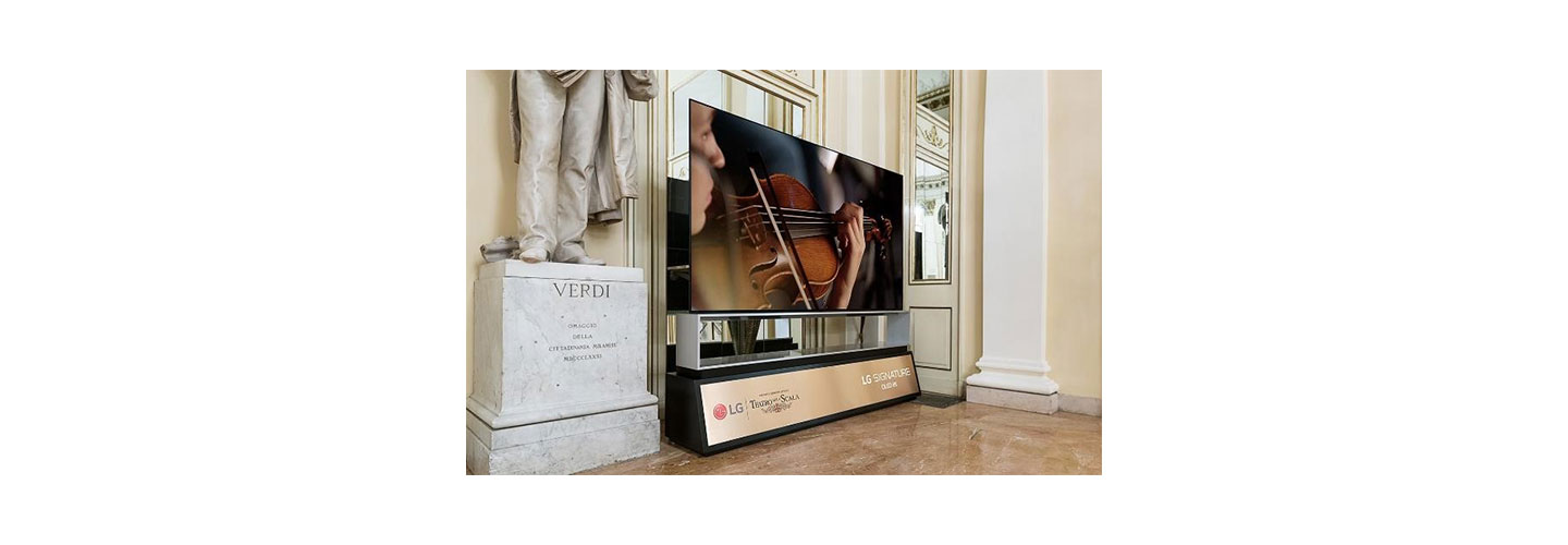  The LG SIGNATURE OLED 8K TV standing next to a statue of Giuseppe Verdi in La Scala displays a musician playing the violin during Rigoletto