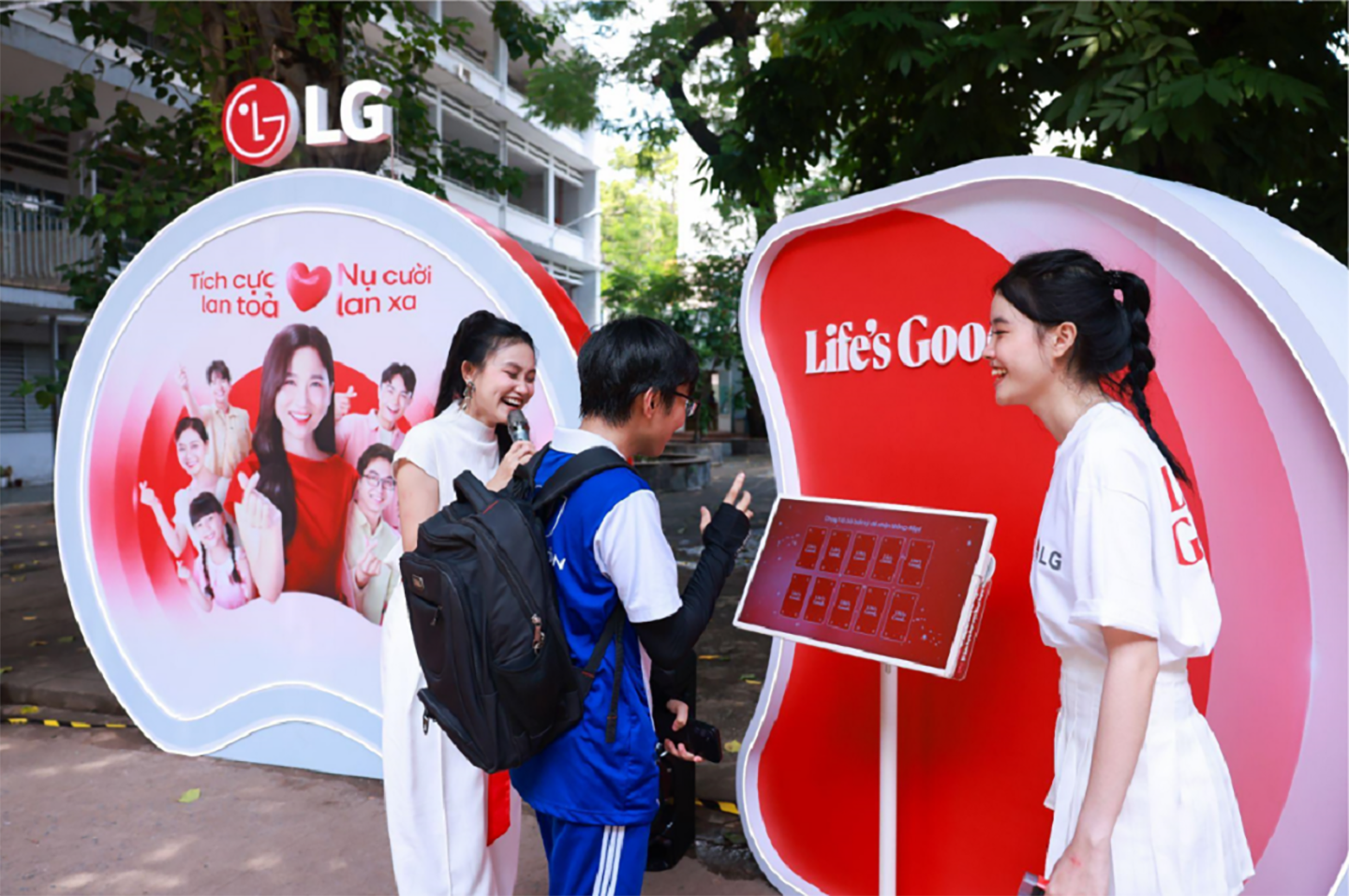 A picture of two women helping out a student participate in an event